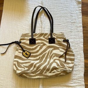 Dooney and Bourk tote. Tan and white tiger stripe and hot pink inside